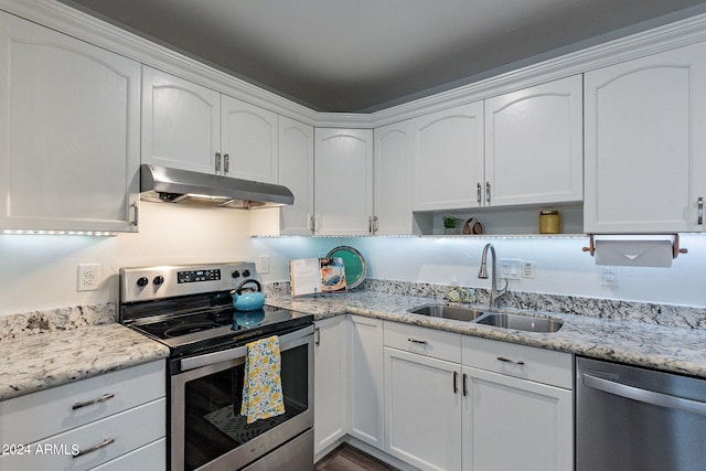 kitchen with appliances with stainless steel finishes, sink, and white cabinets