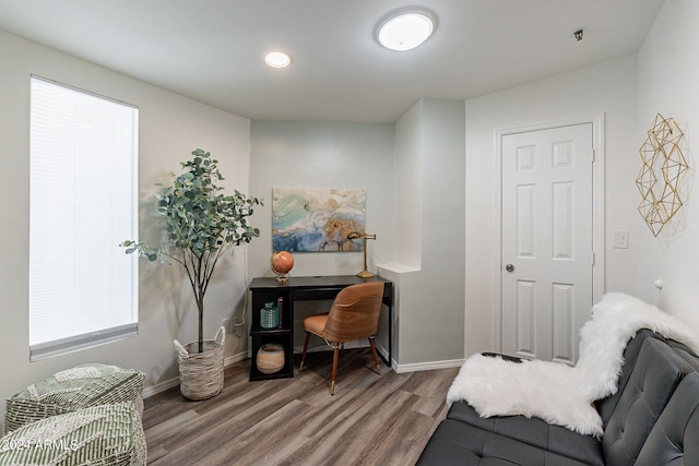 home office with hardwood / wood-style floors