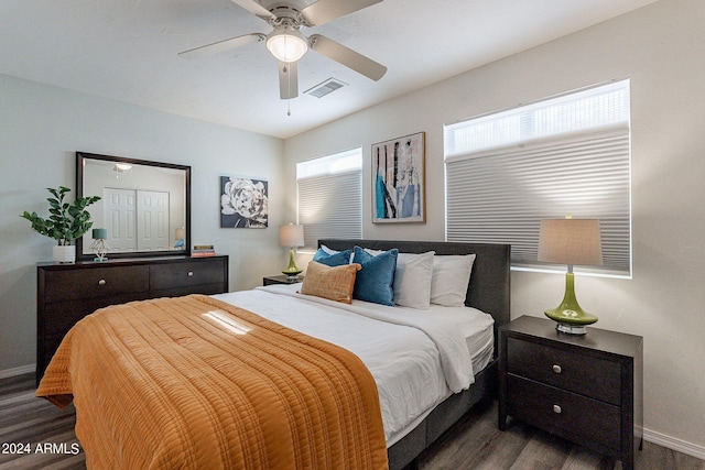 bedroom with ceiling fan and dark wood-type flooring