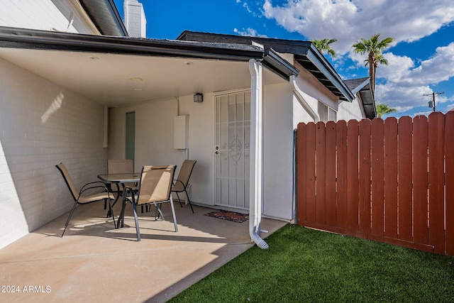view of patio / terrace featuring fence and outdoor dining space