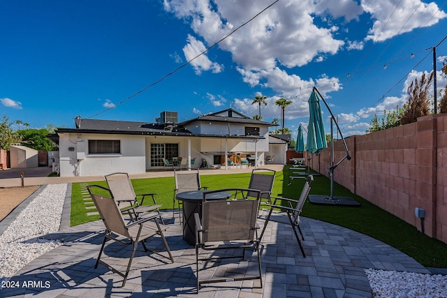 view of patio / terrace featuring a fenced backyard and central AC