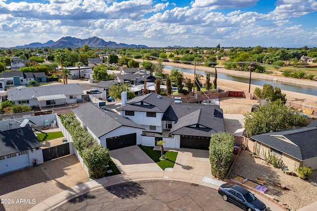 bird's eye view featuring a water and mountain view and a residential view