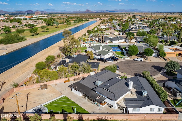 bird's eye view with a residential view and a water and mountain view