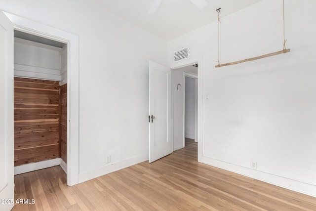 unfurnished bedroom featuring light hardwood / wood-style flooring and ceiling fan