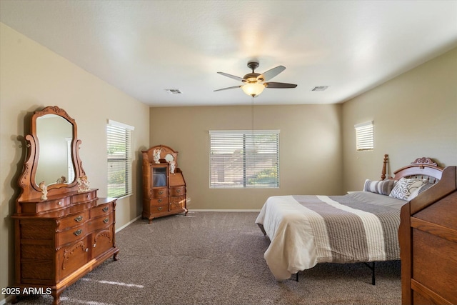 carpeted bedroom with ceiling fan, visible vents, and baseboards