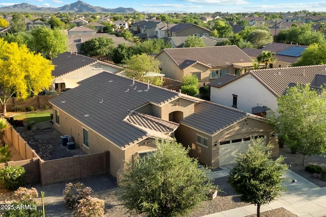 drone / aerial view with a residential view and a mountain view