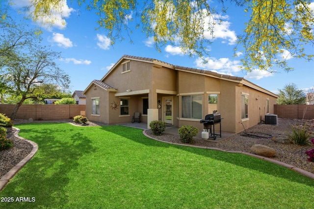 back of property featuring cooling unit, a fenced backyard, a yard, a patio, and stucco siding