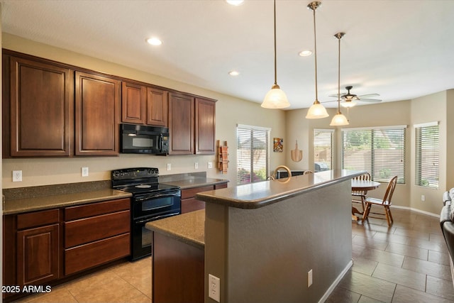 kitchen featuring a healthy amount of sunlight, dark countertops, a ceiling fan, and black appliances
