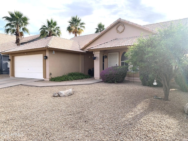 420 N Leoma Ln, Chandler, AZ 85225 - view of front of property with stucco siding, an attached garage, a tile roof, and driveway