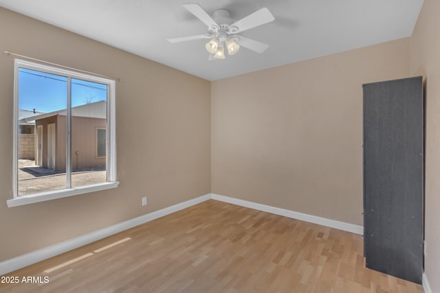 101 W 8th Pl, Mesa, AZ 85201 - spare room featuring baseboards, a ceiling fan, and wood finished floors
