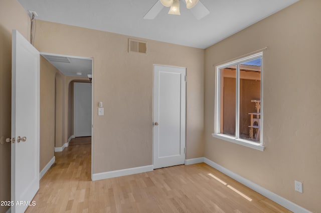 101 W 8th Pl, Mesa, AZ 85201 - empty room with light wood-style flooring, plenty of natural light, baseboards, ceiling fan, and visible vents