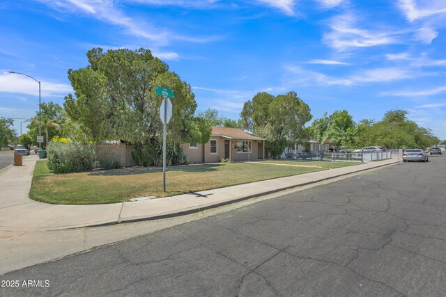 101 W 8th Pl, Mesa, AZ 85201 - view of front of house with stucco siding, fence, and a front lawn