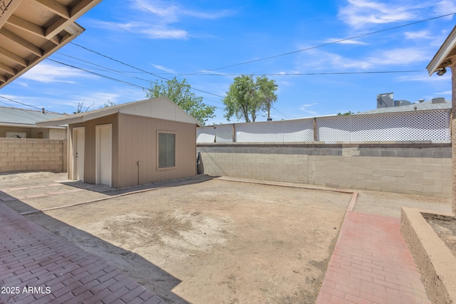 101 W 8th Pl, Mesa, AZ 85201 - exterior space featuring an outbuilding, a patio, a shed, and a fenced backyard