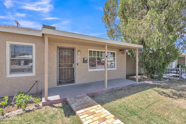 101 W 8th Pl, Mesa, AZ 85201 - property entrance featuring fence, stucco siding, and a lawn
