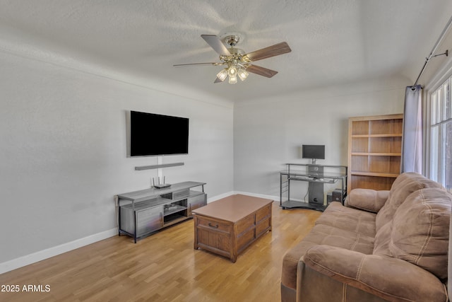 101 W 8th Pl, Mesa, AZ 85201 - living area with a textured ceiling, baseboards, a ceiling fan, and light wood-style flooring