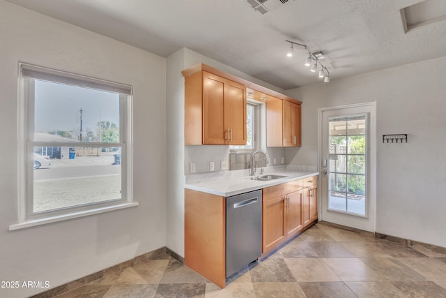 101 W 8th Pl, Mesa, AZ 85201 - kitchen with stainless steel dishwasher, visible vents, baseboards, light countertops, and a sink