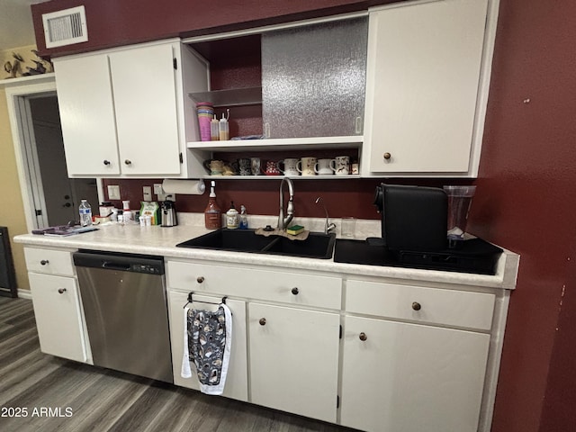 kitchen with open shelves, visible vents, stainless steel dishwasher, white cabinets, and a sink