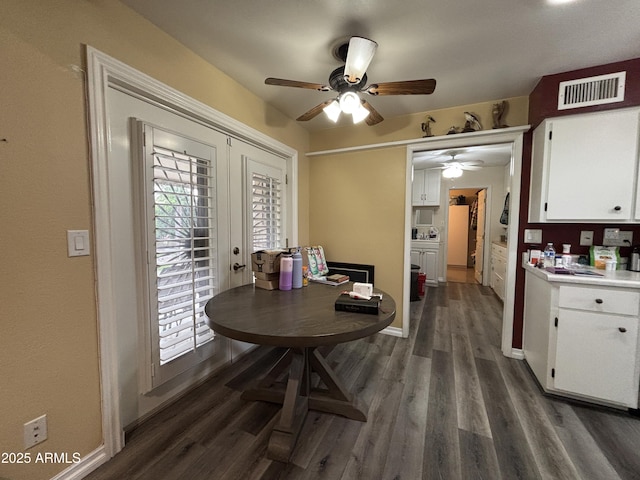 dining room featuring dark wood-style floors, ceiling fan, visible vents, and french doors