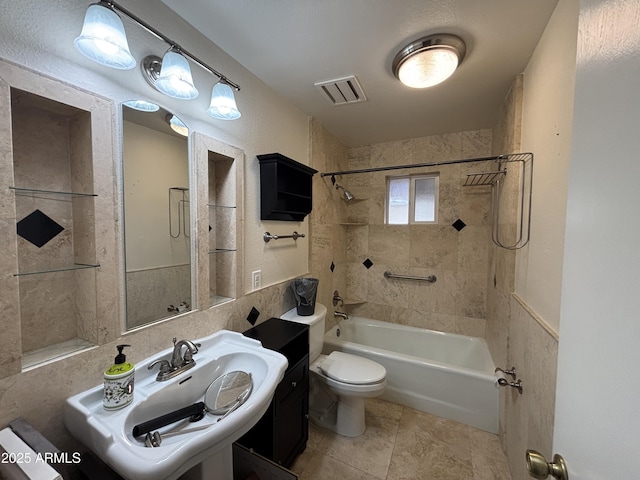 full bath featuring visible vents, a sink, bathing tub / shower combination, and toilet