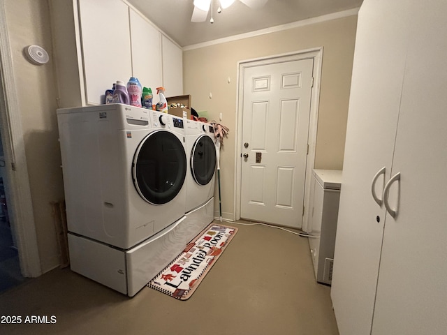 clothes washing area with ceiling fan, cabinet space, and washer and dryer