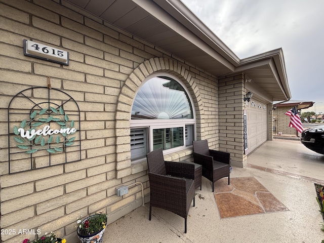 view of patio featuring a garage