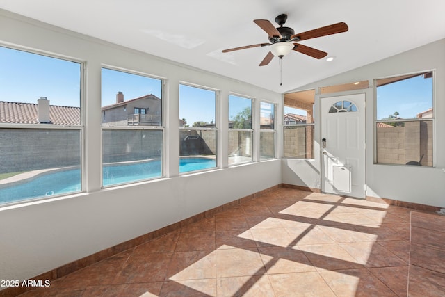 unfurnished sunroom with baseboards, lofted ceiling, and recessed lighting