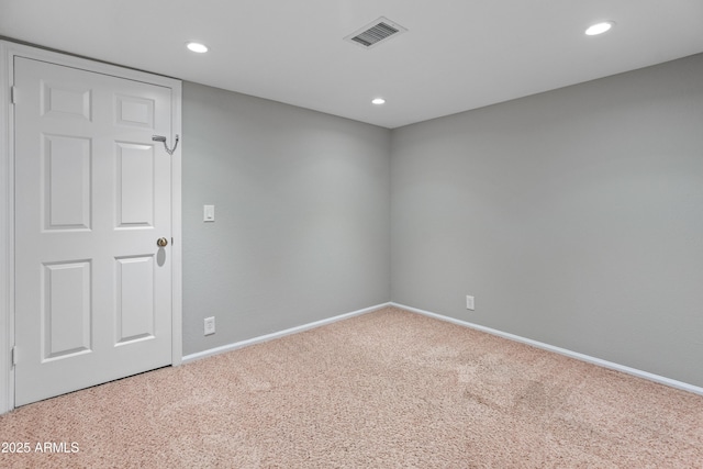 carpeted spare room featuring visible vents, baseboards, and recessed lighting