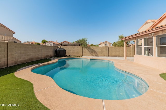 view of swimming pool featuring a patio, a fenced backyard, and a fenced in pool