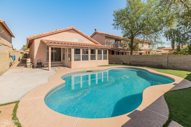 view of swimming pool featuring a fenced in pool, a patio, and a fenced backyard