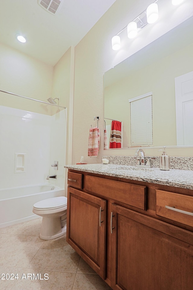 bathroom with vanity, visible vents, tub / shower combination, tile patterned floors, and toilet