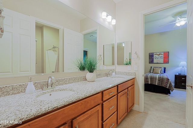 full bathroom with tile patterned flooring, double vanity, connected bathroom, and a sink
