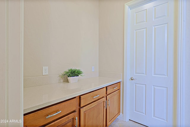 bathroom with vanity and tile patterned floors