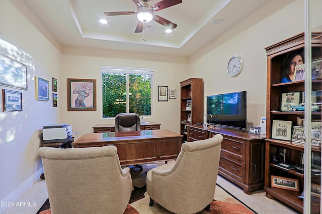 office space with baseboards, ceiling fan, recessed lighting, light tile patterned flooring, and a raised ceiling