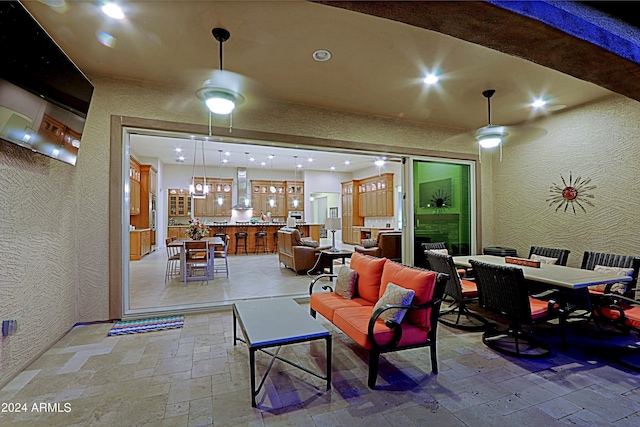view of patio featuring an outdoor living space, outdoor dining area, outdoor dry bar, and ceiling fan
