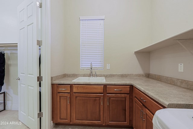 kitchen featuring a sink and light countertops