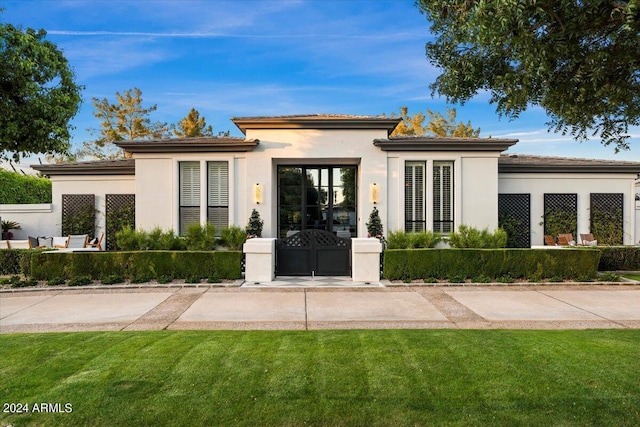 prairie-style house with a front yard