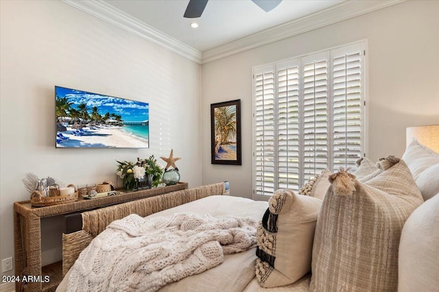 bedroom featuring multiple windows, ceiling fan, and ornamental molding