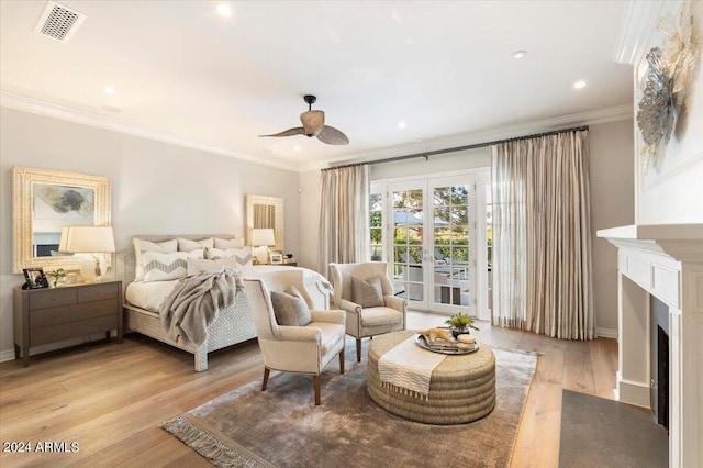 bedroom featuring access to exterior, ceiling fan, french doors, light hardwood / wood-style floors, and ornamental molding