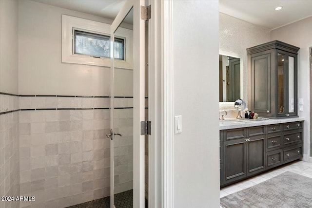 bathroom with tile patterned floors and vanity