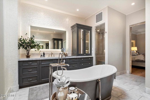 bathroom with vanity and a bathtub