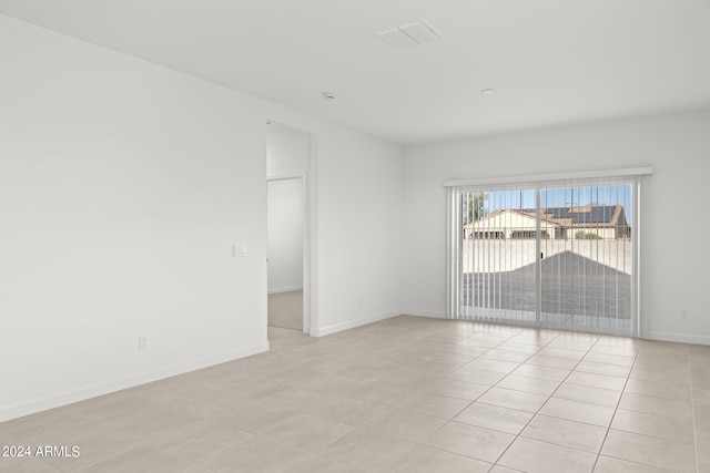1518 S 241st Ave, Buckeye, AZ 85326 - empty room featuring light tile patterned floors and baseboards