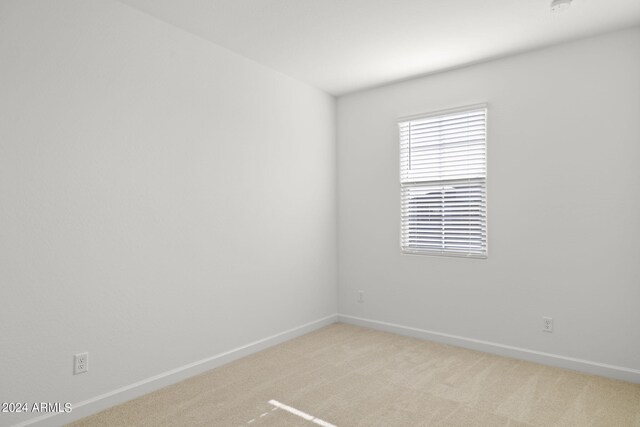 1518 S 241st Ave, Buckeye, AZ 85326 - empty room featuring light colored carpet and a smoke detector