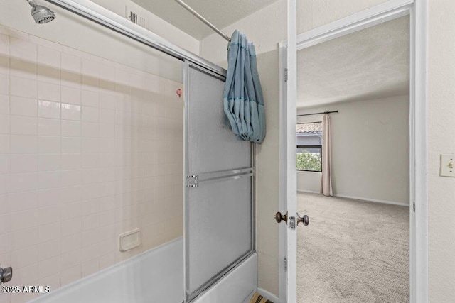 1402 E Guadalupe Rd Unit 215, Tempe, AZ 85283 - bathroom featuring bath / shower combo with glass door