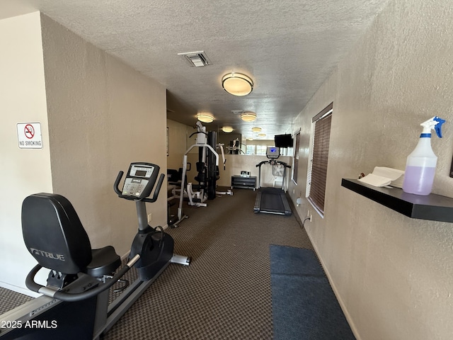 1402 E Guadalupe Rd Unit 215, Tempe, AZ 85283 - exercise room with carpet floors, a textured wall, and a textured ceiling