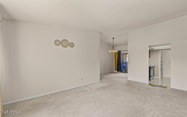 1402 E Guadalupe Rd Unit 215, Tempe, AZ 85283 - spare room with a chandelier, light carpet, and baseboards