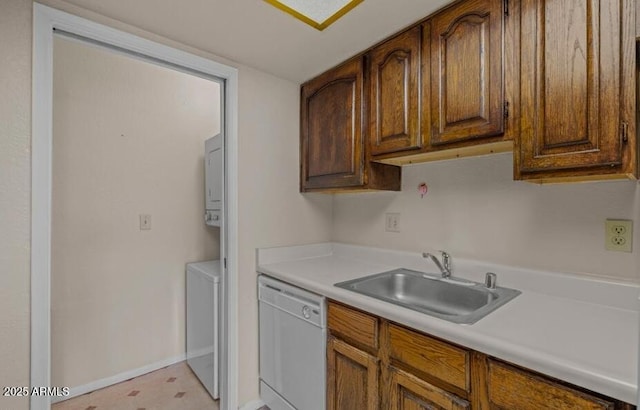 1402 E Guadalupe Rd Unit 215, Tempe, AZ 85283 - kitchen featuring white dishwasher, a sink, stacked washing machine and dryer, and light countertops