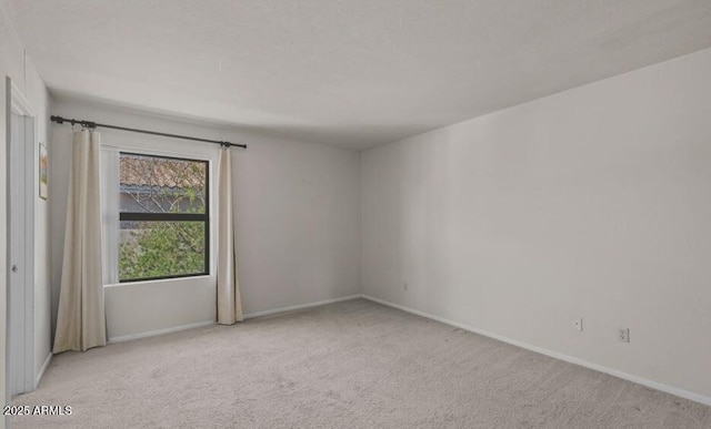 1402 E Guadalupe Rd Unit 215, Tempe, AZ 85283 - carpeted spare room featuring baseboards