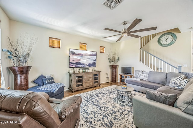 living room with ceiling fan and wood-type flooring