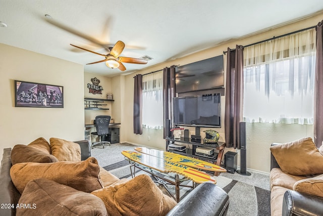 living room featuring carpet and ceiling fan