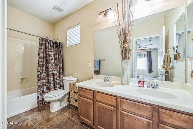 full bathroom featuring plenty of natural light, shower / tub combo with curtain, toilet, and vanity